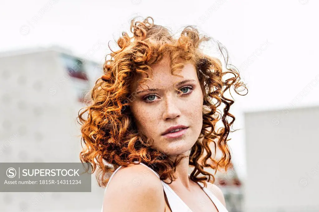 Portrait of redheaded woman outdoors