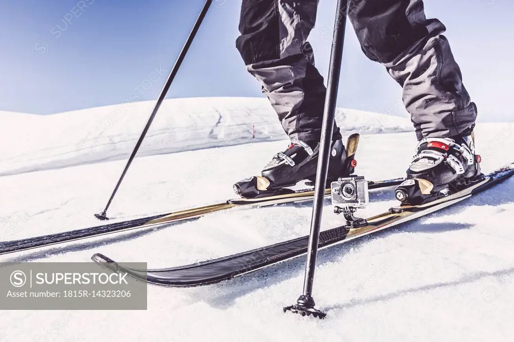 Close-up of skier with action cam in winter landscape