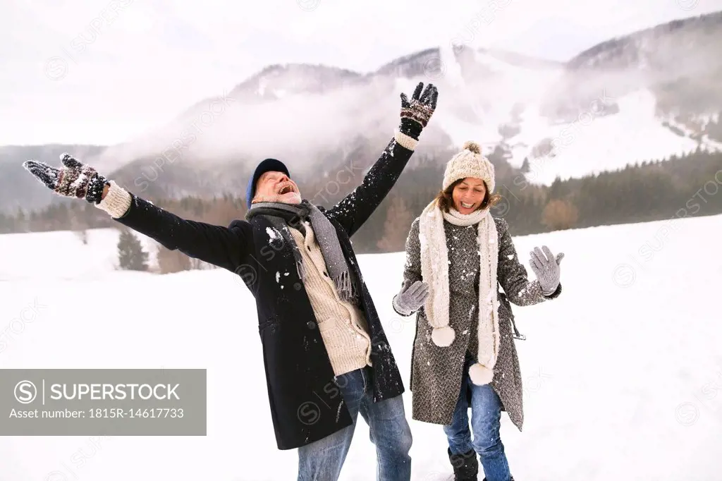 Happy senior couple in the snow