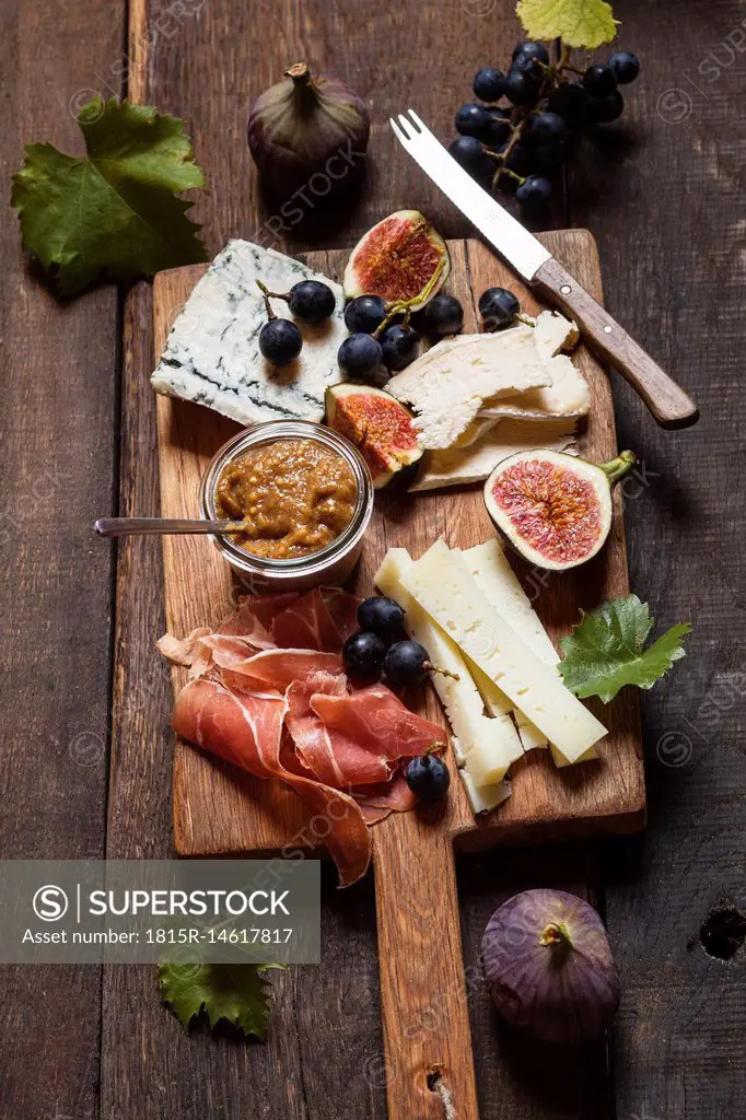 Cheese platter with fruits and fig mustard