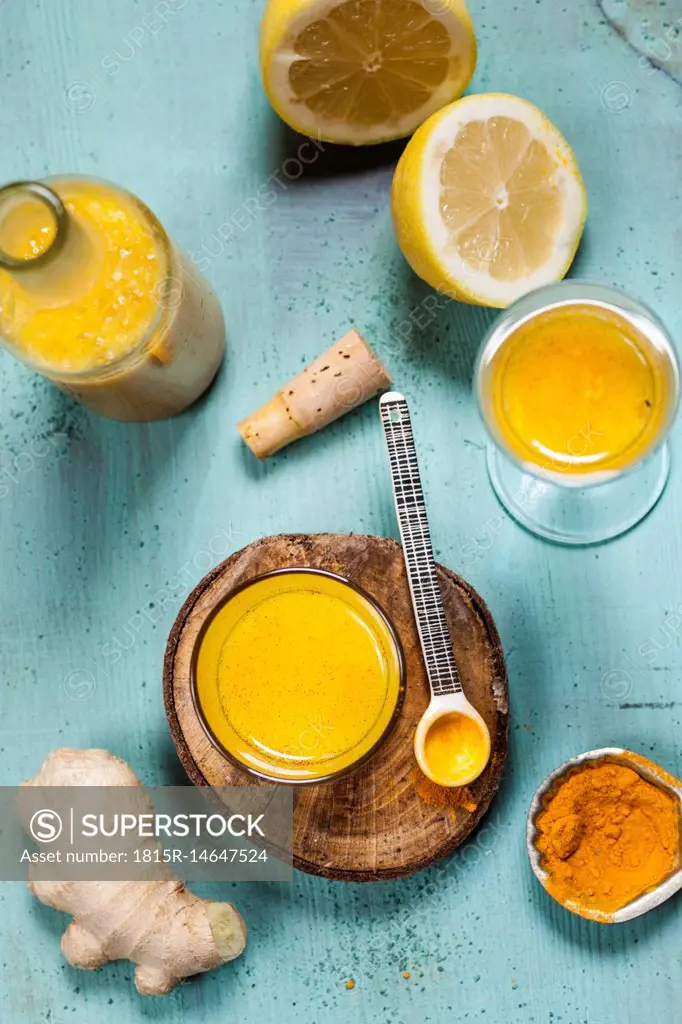 Detox drink, ginger, lemon and orange juice with curcuma and chilli powder