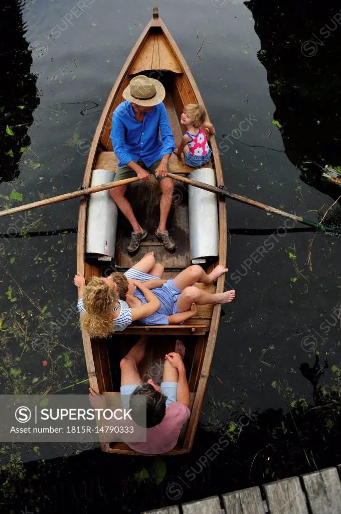 Family in rowing boat, top view