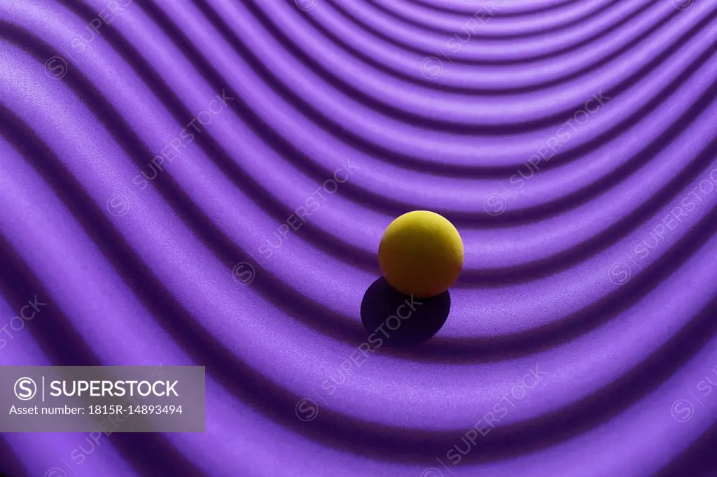 Yellow sphere over a geometric purple background, 3D Rendering