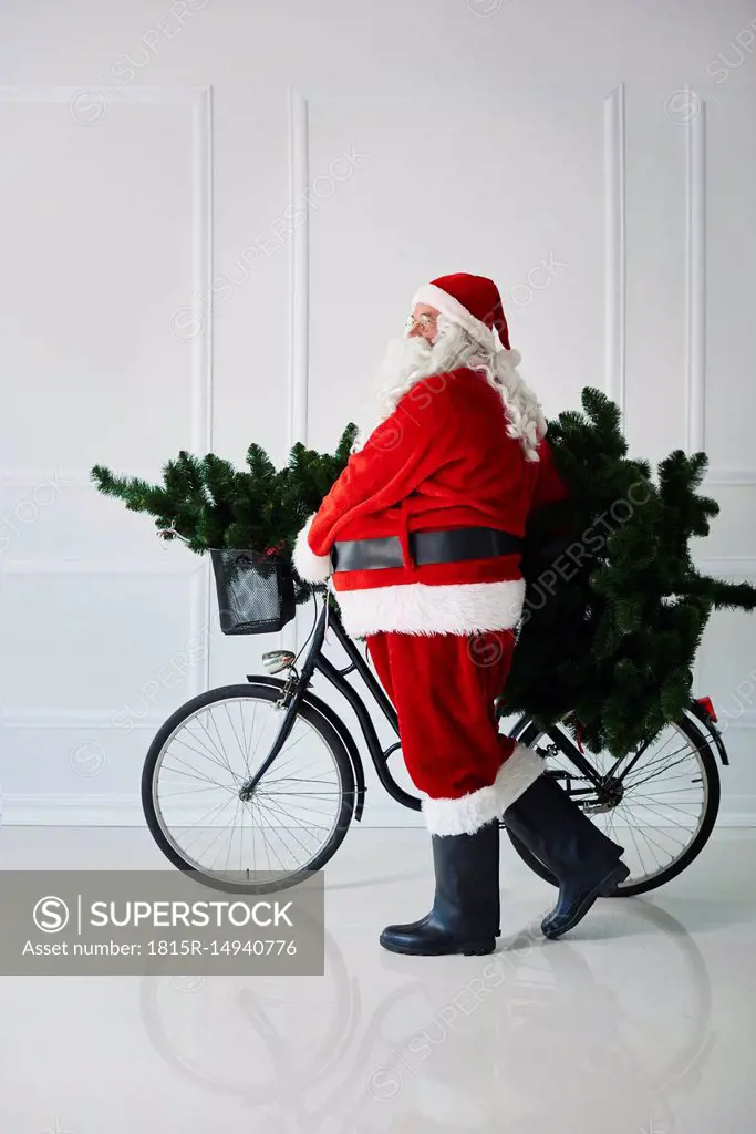 Santa Claus carrying with bicycle