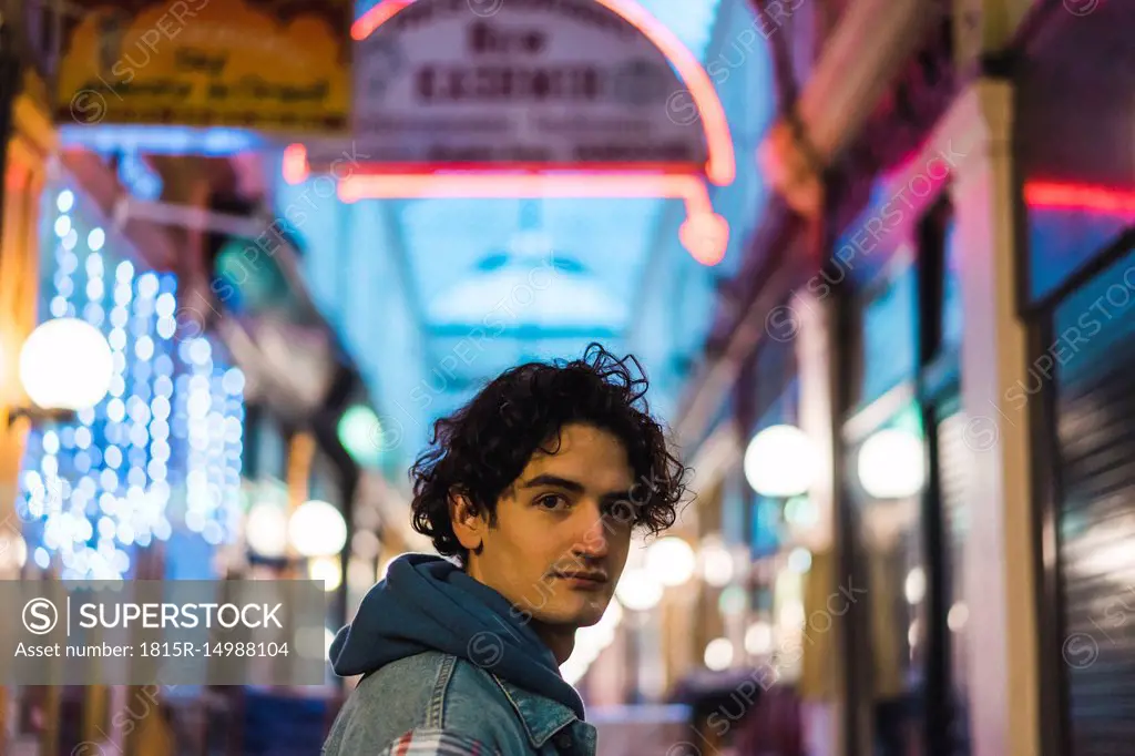 Portrait of young man in shopping centre