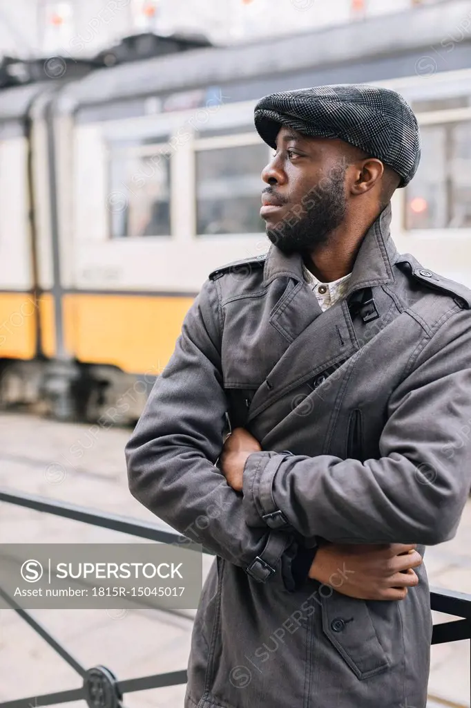 Portrait of stylish man in the city looking around