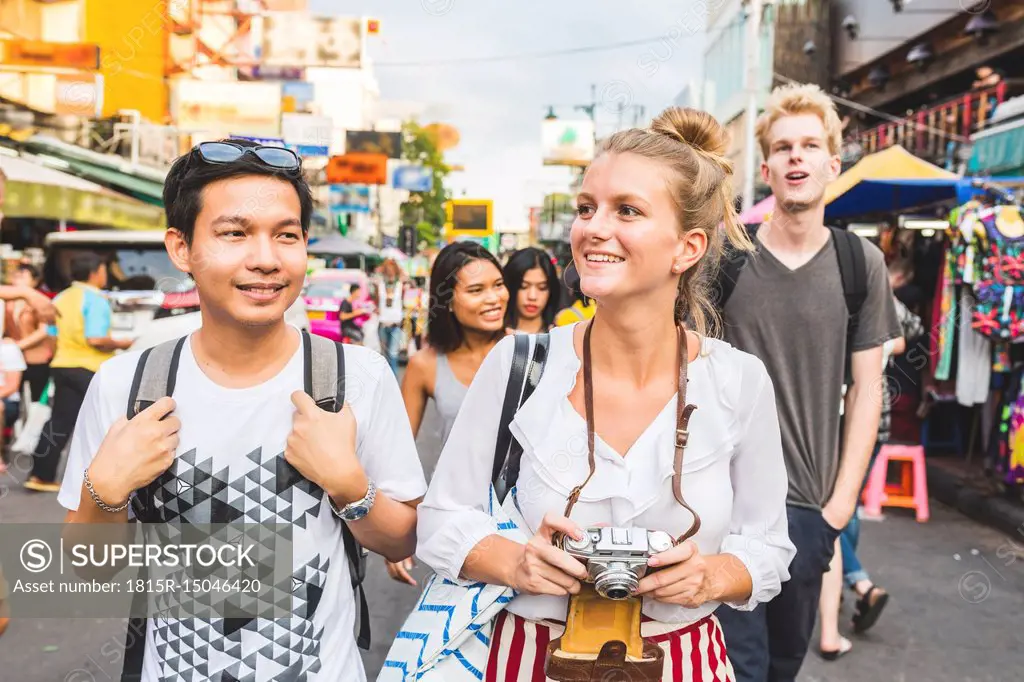 Thailand, Bangkok, Khao San Road, portrait of friends exploring the city