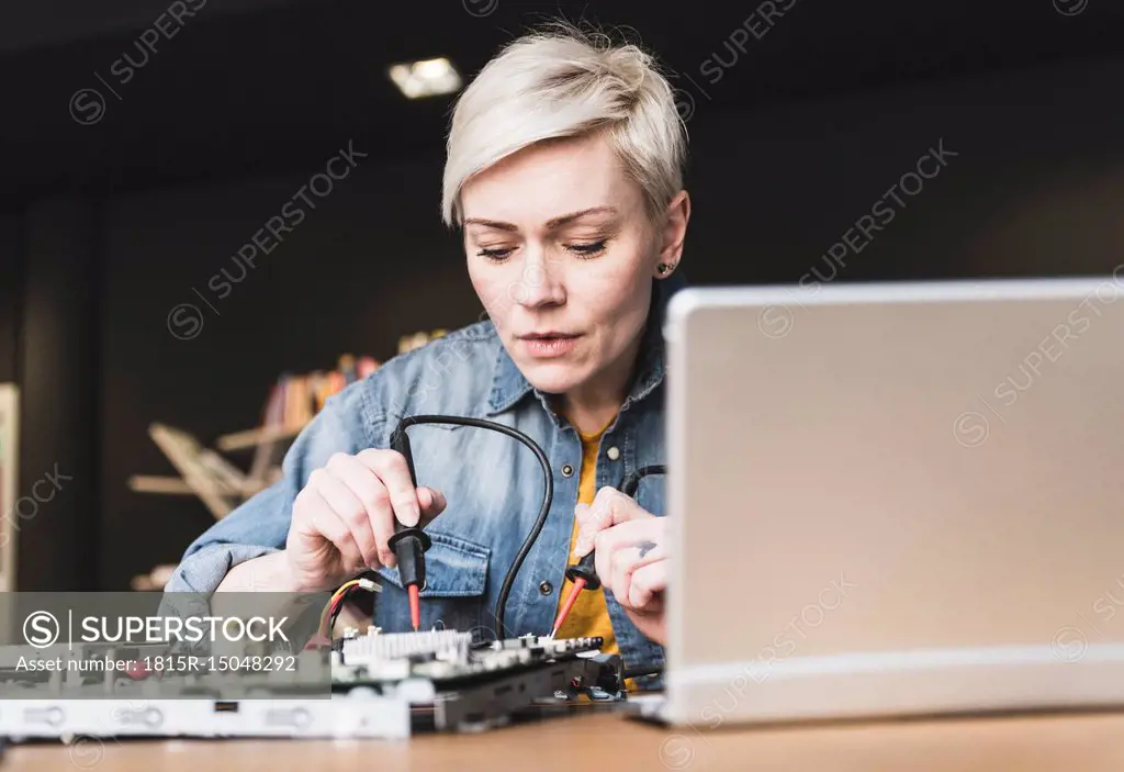 Woman working on computer equipment