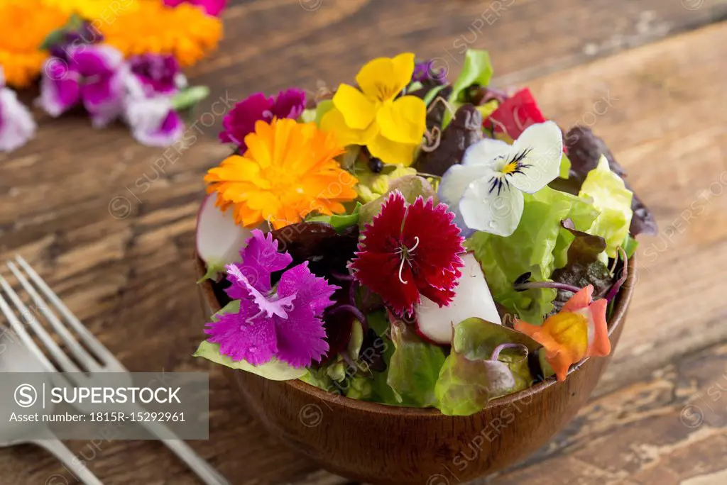 Bowl of salad with edible flowers