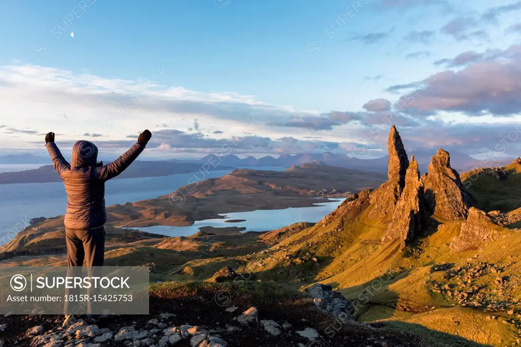 UK, Scotland, Inner Hebrides, Isle of Skye, Trotternish, tourist on peak near The Storr