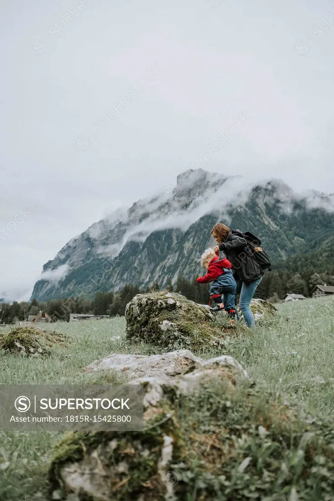 Austria, Vorarlberg, Mellau, mother and toddler on a trip in the mountains