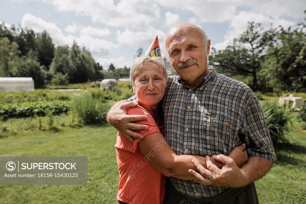 Portrait of senior couple embracing each other in the garden