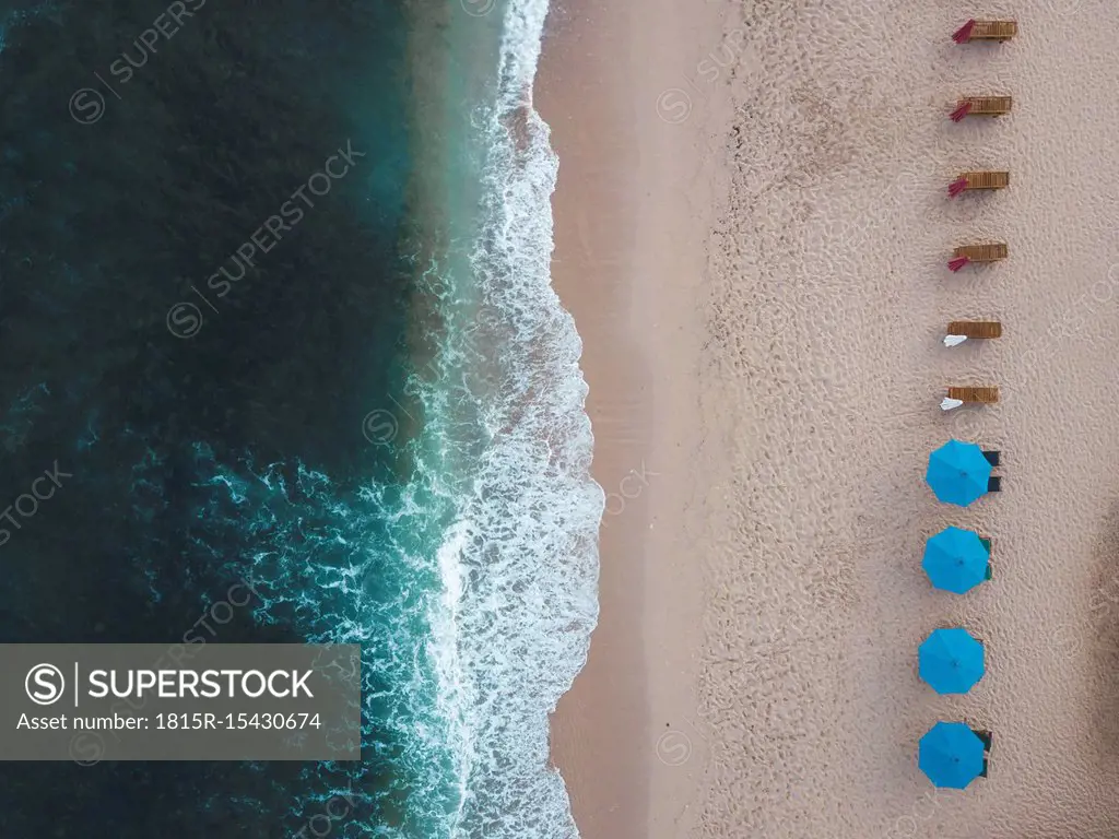 Indonesia, Bali, Aerial view of Balangan beach, empty sun loungers