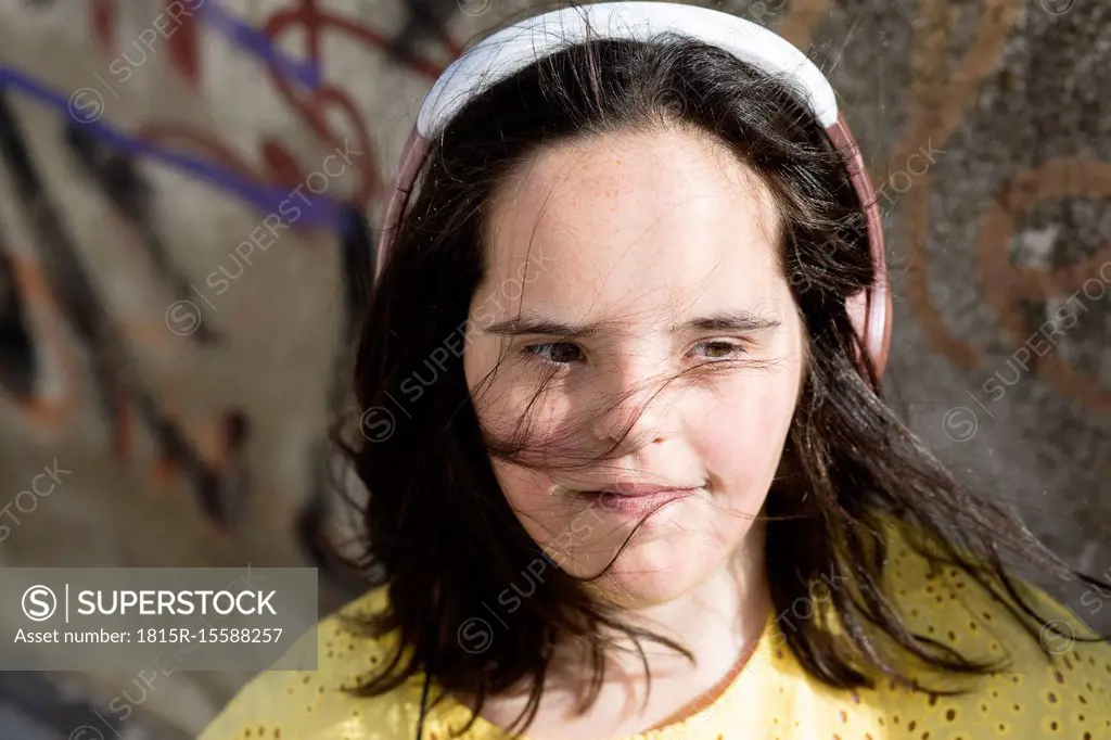 Teenager girl with headphones, listing music