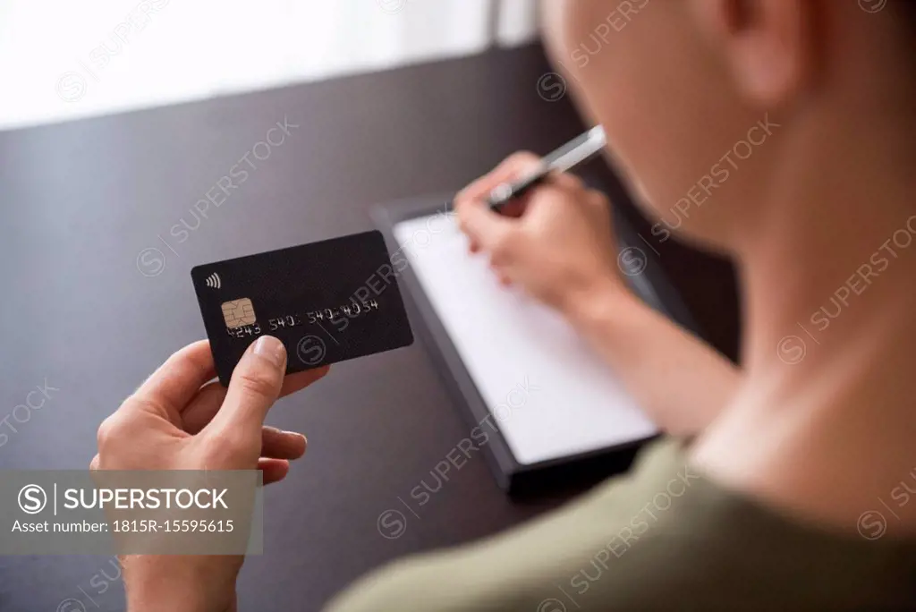 Close-up of hand holding credit card