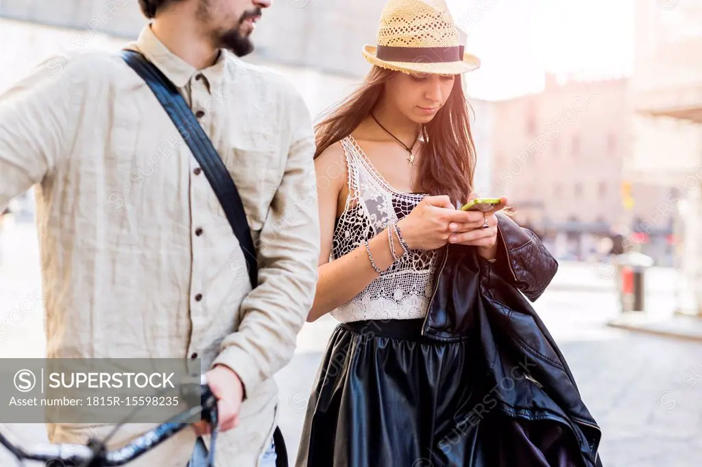 Young woman using smartphone in the city