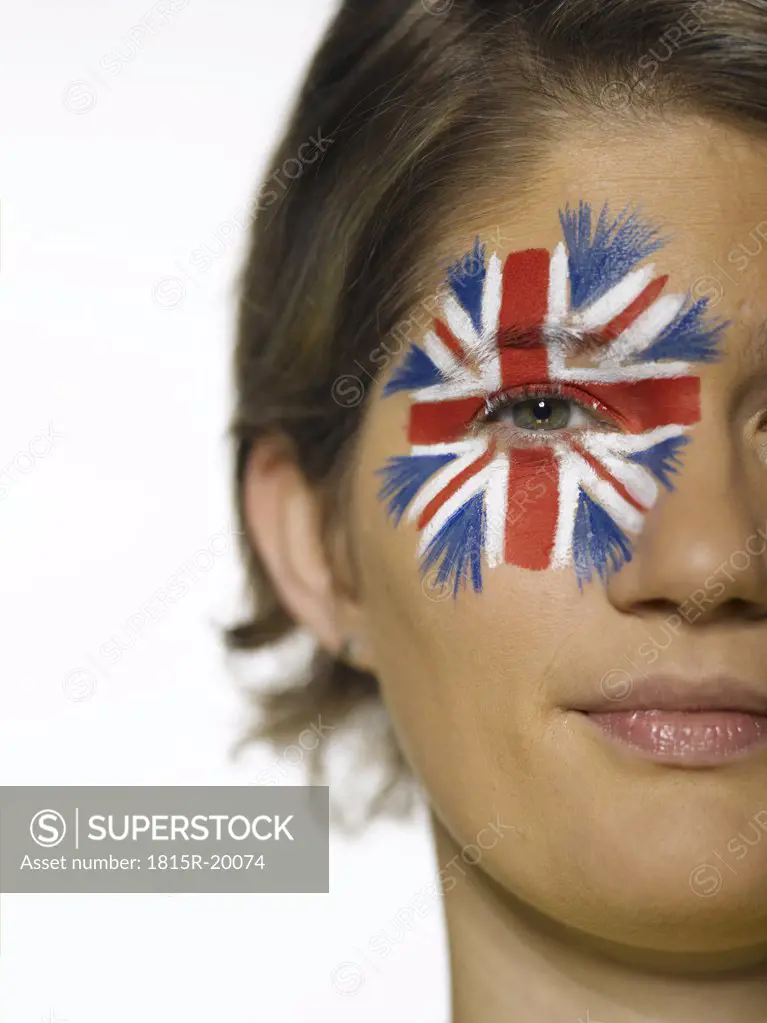 Woman with Union Jack painted on face, portrait