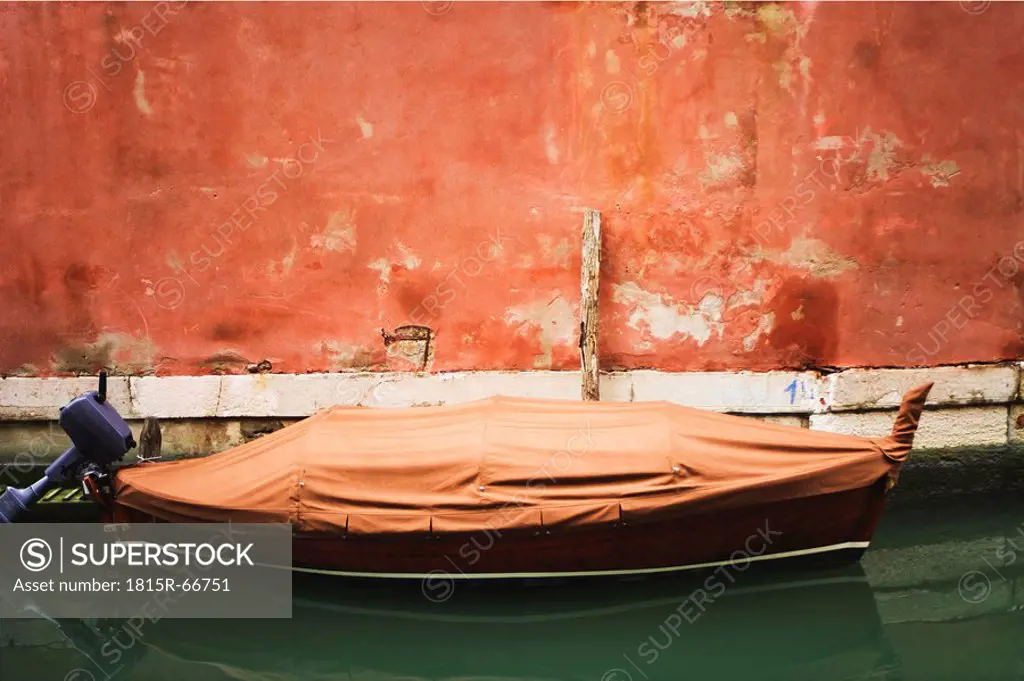 Italy, Venice, Boat anchoring in canal