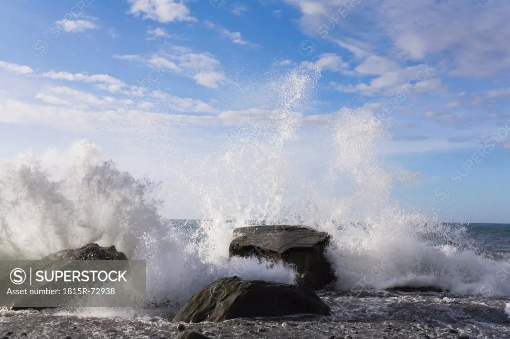 New Zealand, South Island, West Coast, View of water splashing on rock