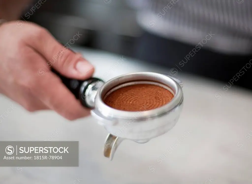 Croatia, Zagreb, Barkeeper making coffee in cafe