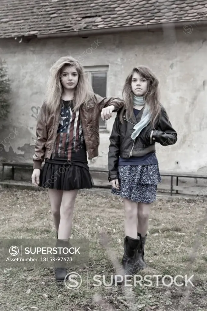 Germany, Bavaria, Two girls walking on backstreet