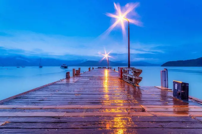 New Zealand, South Island, Akaroa, wooden pier at night