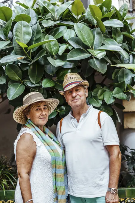Portrait of senior couple with leaf background, El Roc de Sant Gaieta, Spain