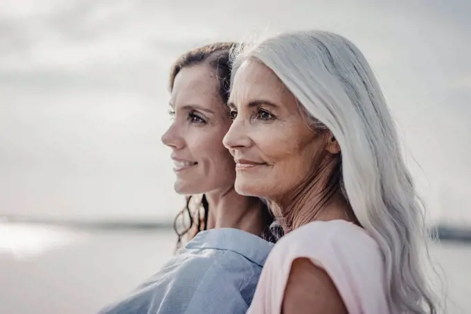 Mother and daughter spending a day at the sea, portrait
