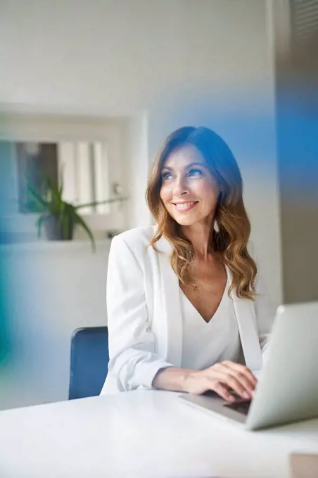 Business woman using laptop