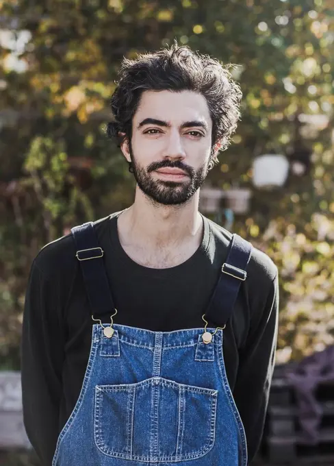 Portrait of bearded man in garden