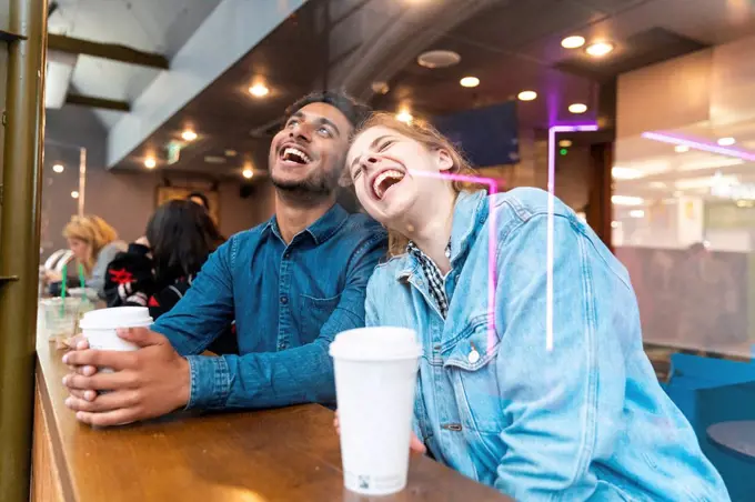 Friends having fun together in a coffee shop