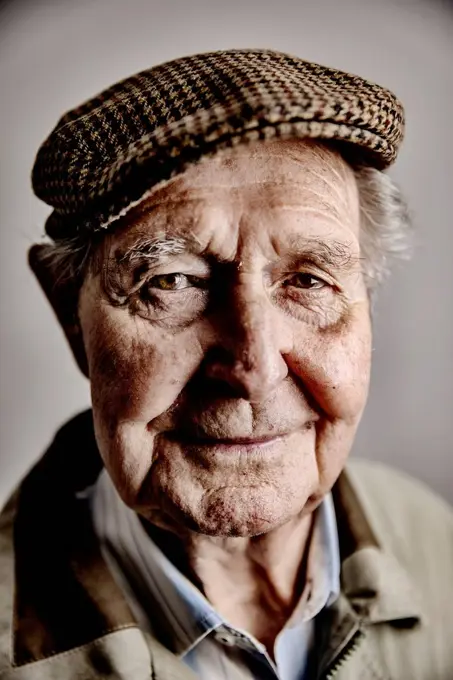 Portrait of smiling senior man wearing cap