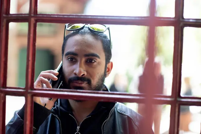 Portrait of bearded young man on the phone