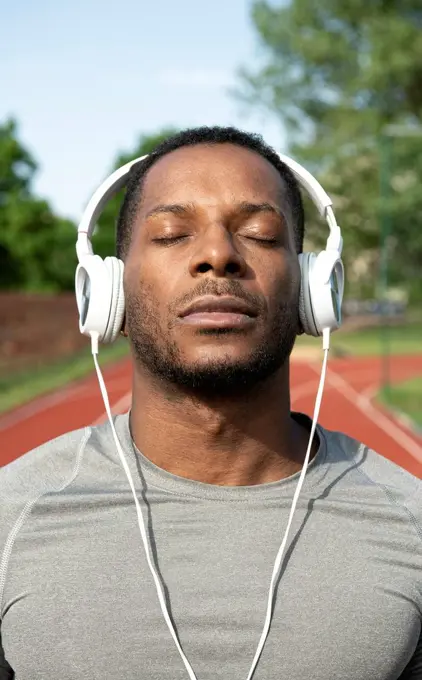 Sportsman listening to the music at racetrack