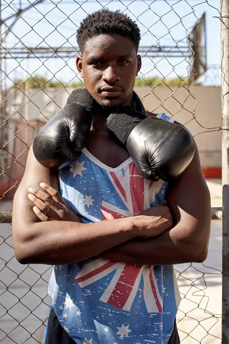 Portrait of confident boxer with his boxing gloves