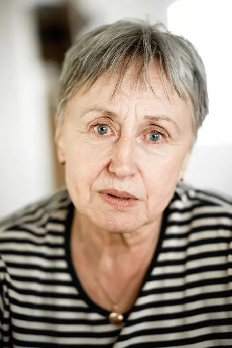 Portrait of senior woman with short hair, respectable looking in camera