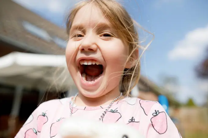 Portrait of happy girl outdoors