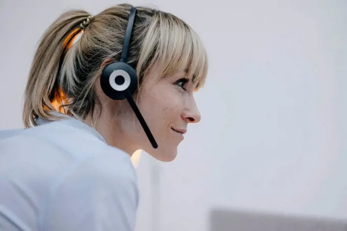 Businesswoman having a conference call with headset