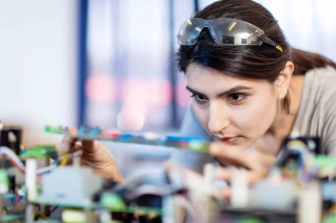 Woman working on computer equipment