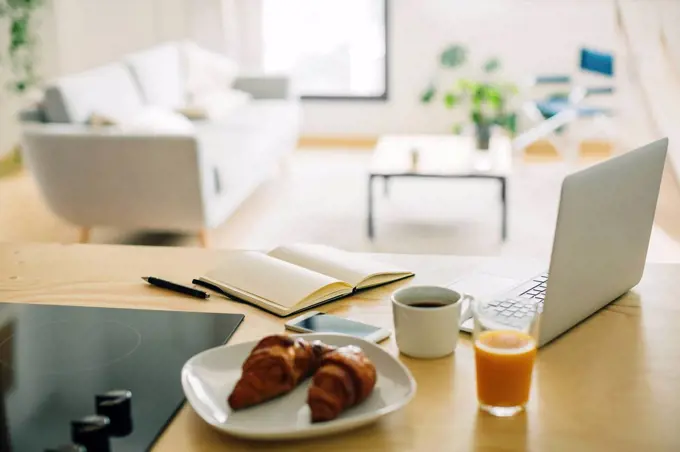 Home office and breakfast on the kitchen counter