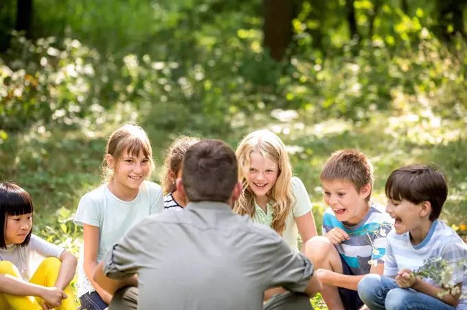 School children learning to to distinguish different plants