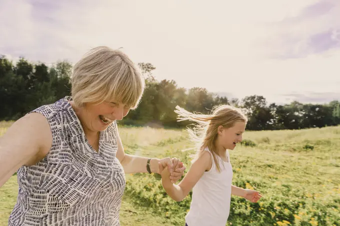 Grandmother and granddaughter roller skating