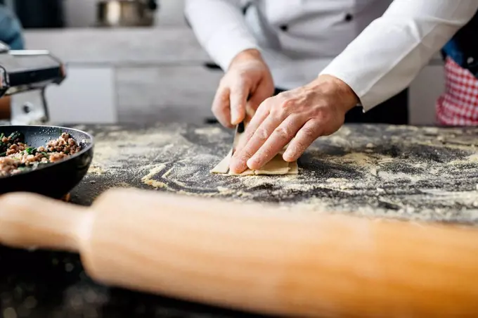Close-up of man preparing homemade gluten free pasta
