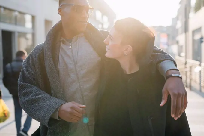 Young couple in the city at sunset