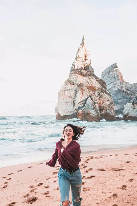 Young woman at Praia da Ursa, Lisboa, Portugal