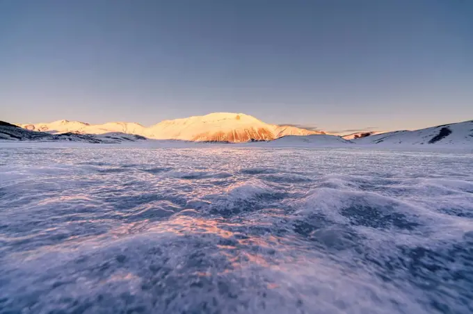 Piano Grande of Castelluccio di Norcia plateau and Vettore in winter, Umbria, Italy