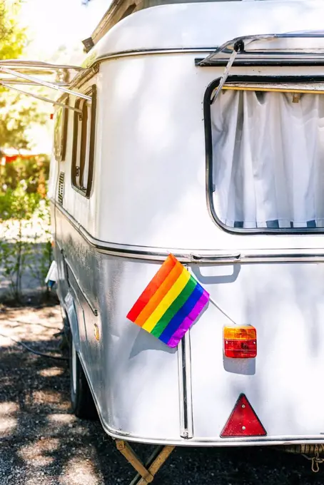 Close-up of rainbow flag in tail light on motor home