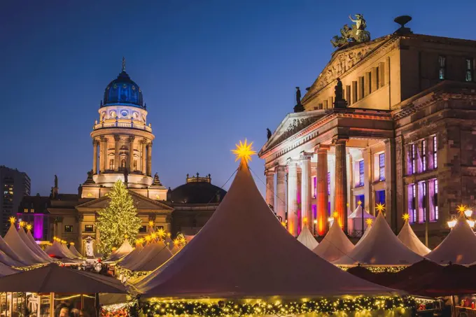 Germany, Berlin, Christmas market at Gendarmenmarkt in front of the Concert Hall right and German Cathedral