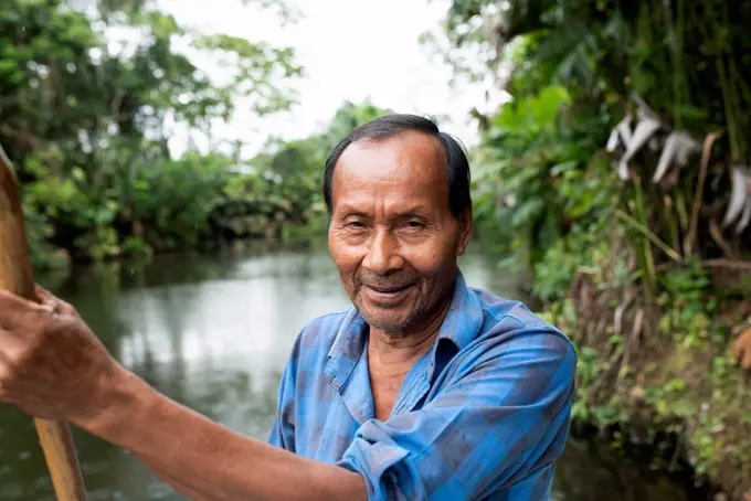 Smiling senior Guarani man at Napo River, Ecuador