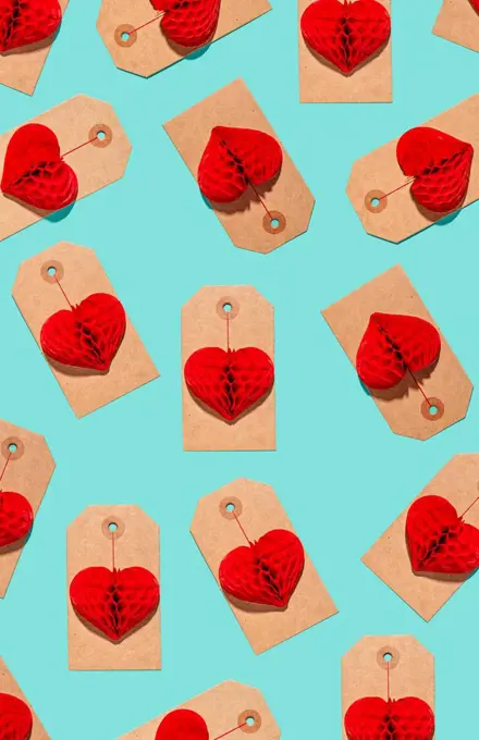 Pattern of labels with heart shaped paper craft decorations